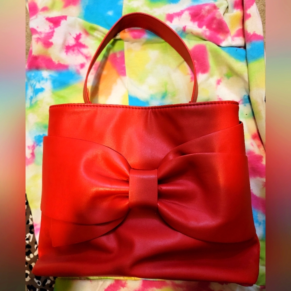 Betsey Johnson red leather handbag with bow embellishment, nearly new condition.